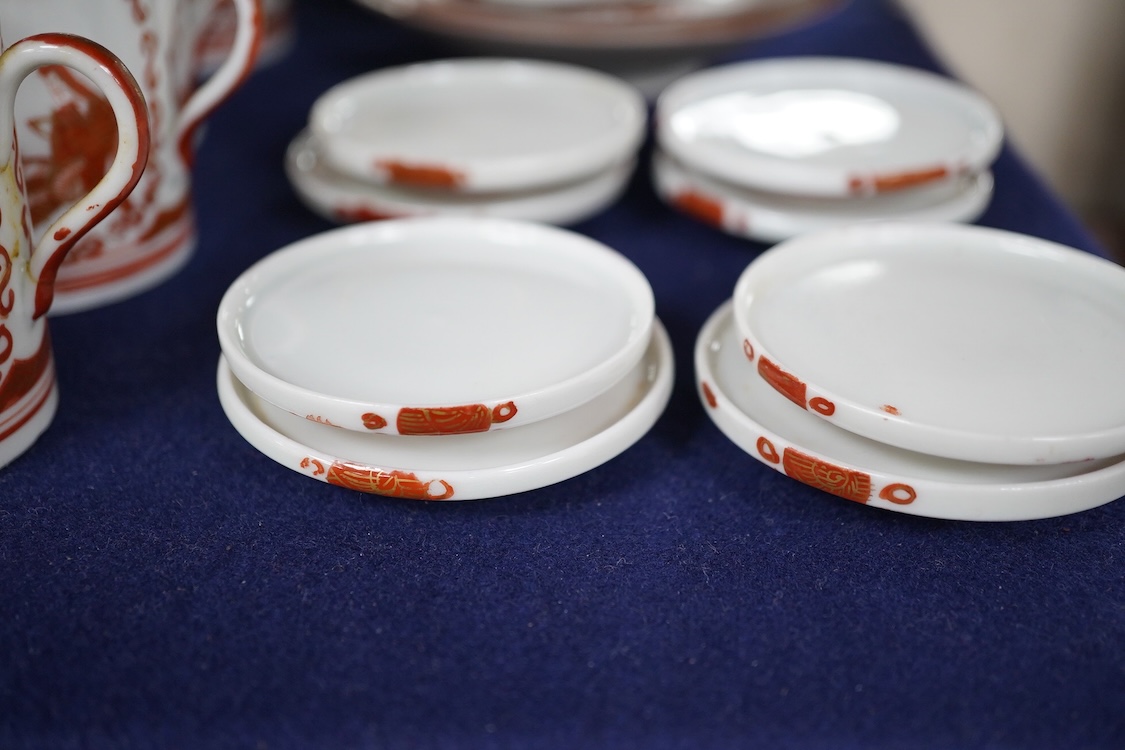 A Japanese Kutani Sake set, twelve cups, covers and saucers and two spare saucers. Condition - poor